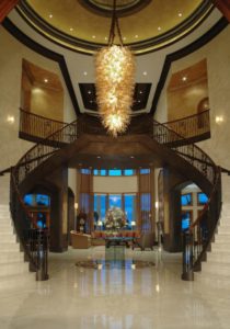 Custom glass chandelier, custom iron railing, faux finishing, marble floors,